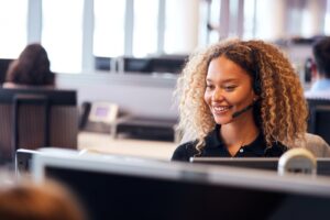 Young Businesswoman Wearing Telephone Headset