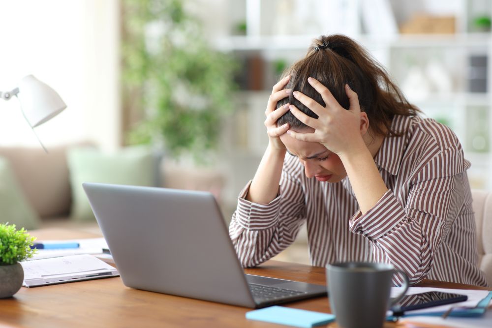 A frustrated woman at her computer